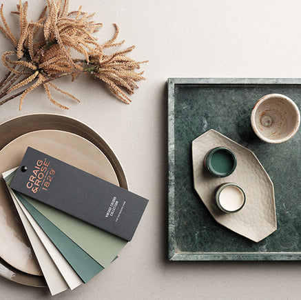 Craig & Rose paints colour fan deck, sample pots of paint and green marble tray